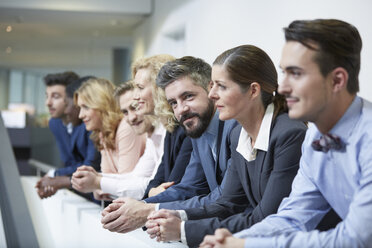 Germany, Neuss, Group of business people, leaning on railing - STKF000781