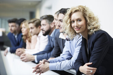 Germany, Neuss, Group of business people, leaning on railing - STKF000777