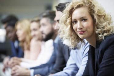 Germany, Neuss, Group of business people, leaning on railing - STKF000776