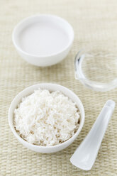 Bowls of jasmine rice, coconut milk and water - EVGF000273