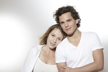 Portrait of dreamy young couple, studio shot - FMKF000937