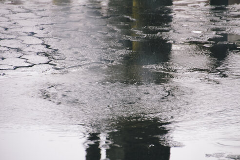 Brazil, Sao Paulo, Puddle in the middle of rainstorm - AMCF000005