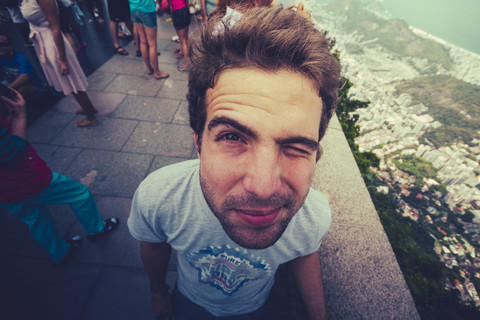 Brazil, Rio de Janeiro, Corcovado, Man twinkling his eye stock photo