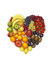 Variety of vegetables and fruits on white background, heart shape - STKF000890