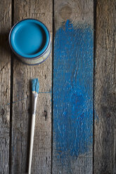 Old wooden boards with brush, paint tin and partial blue paint - SARF000160