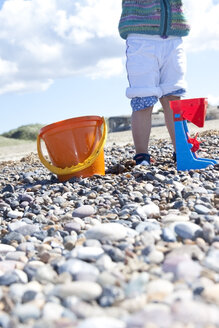 Denmark, Blavand, little girl playing on the beach, partial view - JFEF000239