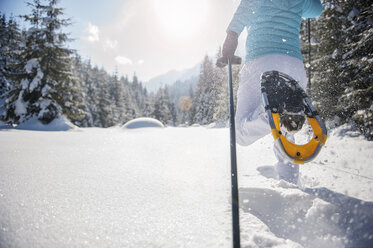 Austria, Salzburg State, Altenmarkt-Zauchensee, Woman snowshoeing in winter landscape - HHF004683
