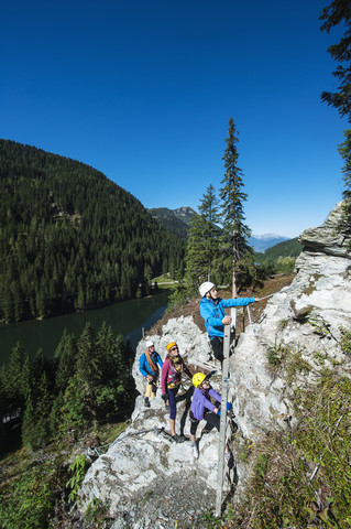 Austria, Salzburg State, Altenmarkt-Zauchensee, family at via ferrata stock photo