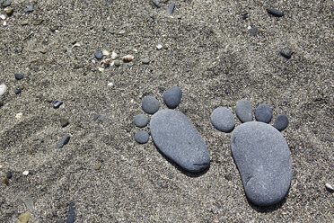 France, Bretagne, Beach of Pordic, Feet made of pebbles - BIF000205