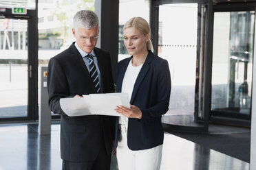 Germany, Business people discussing documents - CHAF000002