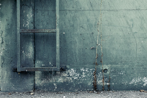 Germany, Bavaria, old concrete wall and ladder stock photo