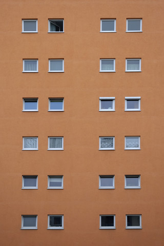 Orange house facade with squared windows stock photo