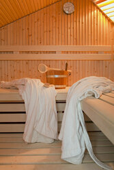 Germany, Aachen, sauna, wooden benches, bathrobes, brush and tub - HL000316