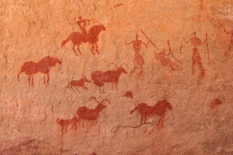 North Africa, Sahara, Algeria, Tassili N'Ajjer National Park, Tadrart, neolithic rock art, rock painting of horses, riders and goats stock photo