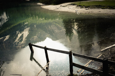 Italy, Trentino-Alto Adige, Alto Adige, Puster Valley, water reflection and lakeshore of Lake Prags - MJF000457