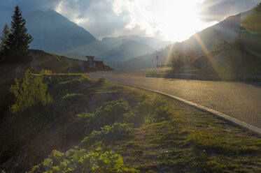 Italy, Dolomite Alps, road at evening twilight - MJF000495