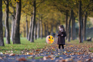 Germany, Rhineland-Palatinate, Neuwied, girl with lantern in a park - PA000162