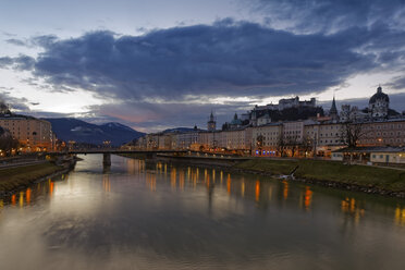 Austria, Salzburg State, Salzburg, fortress Hohensalzburg with old town and towers of Salzburg Cathedral, Salzach River, right collegiate church, in the evening - GF000341
