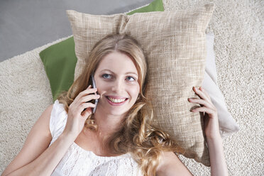 Young woman telephoning at home - PDF000607