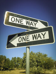 Two One Way Signs pointing in opposite directions - ABAF001154