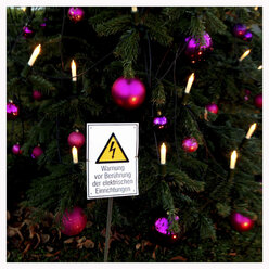 Warning symbol in front of Christmas tree, Munich, Bavaria, Germany - GSF000628