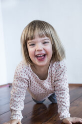 Portrait of smiling little girl on all fours - LVF000444