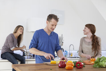 Three friends cooking together - RBF001596