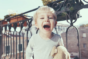 Italy, Sicily, Palermo, Blond boy on balcony - MFF000751