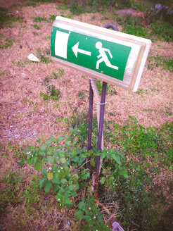 Emergency exit sign on grass, Palermo, Sicily, Italy - MEAF000034