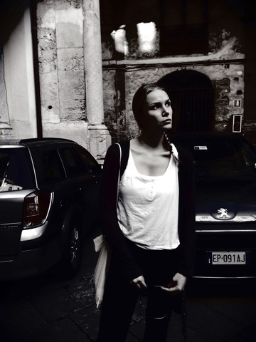 Young woman standing in the streets of Palermo, Sicily, Italy stock photo