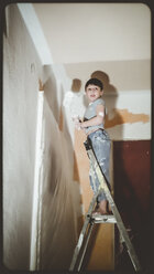 Child on the head, helps painters, Baden-Wuerttemberg, Germany - SBDF000422