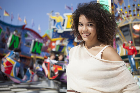 Germany, Herne, Young woman at fairground, portrait - BGF000077