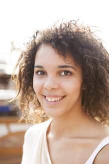 Germany, Herne, Young woman at fairground, portrait - BGF000078