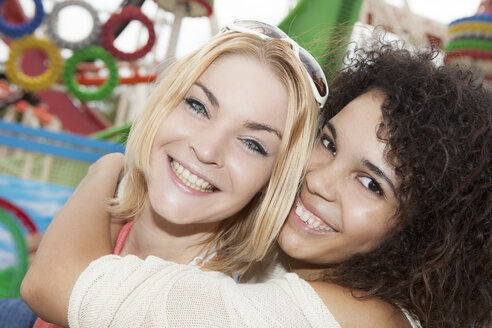 Germany, Herne, Two young women at the fairground, portrait - BGF000069