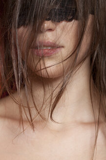 Young woman with covered eyes, close up - BGF000054