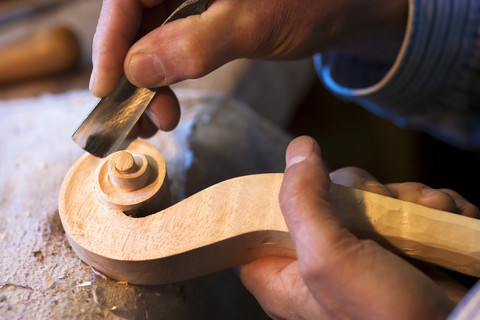 Violin maker at work stock photo