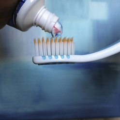 Pressing toothpaste on a brush, Hamburg, Germany - SEF000421