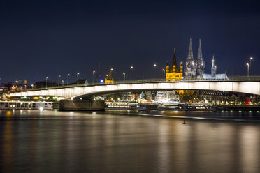 Germany, North Rhine-Westphalia, Cologne, view to Deutz Bridge, Great St Martin and Cologne Cathedral by night - JATF000572