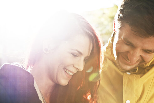 Portrait of young couple watching something - FEXF000055