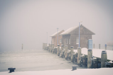 Germany, Mecklenburg-Western Pomerania, Ruegen, Pier in Gager in winter - MJF000670