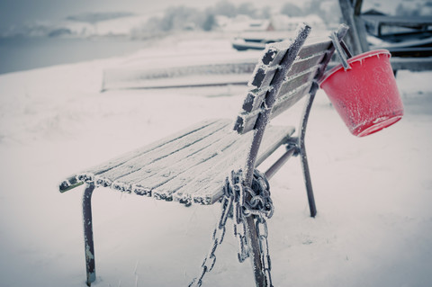 Germany, Mecklenburg-Western Pomerania, Ruegen, Empty bench in winter stock photo