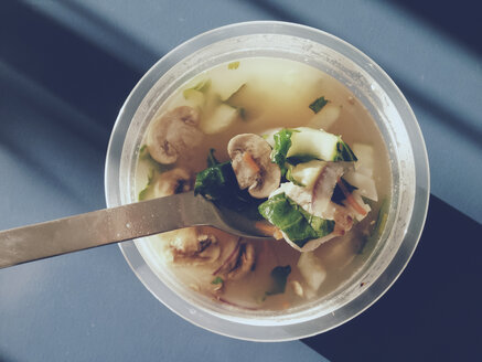 Vegetable and chicken broth in a pot with a spoon on table, Bonn, NRW, Germany - MFF000772