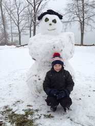 Boy with snowman, Germany, Baden-Wuerttemberg, Constance - JEDF000103