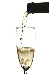 Pouring sparkling wine into champagne flute - YFF000009