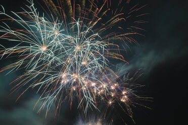 Germany, Bavaria, Kochel am See, fireworks at night sky - LAF000472