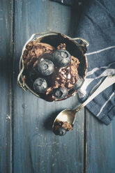 Chocolate ice cream topped with chocolate sauce in the cup, with blueberries, Studio - SBDF000485