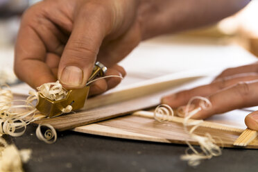 Guitar maker in his workshop, close-up - TC003846