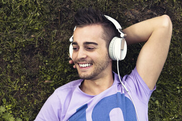 Portrait of smiling man with headphones - DAWF000077