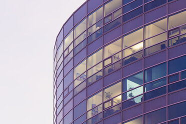 Germany, Baden-Wuerttemberg, Stuttgart, part of facade of office building at twilight - WDF002240