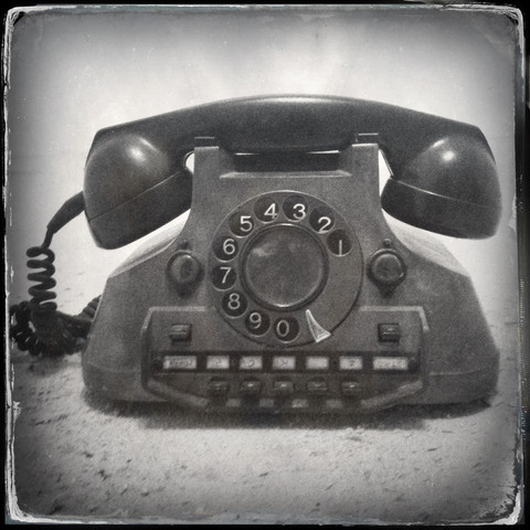 Altes Retro-Telefon mit altmodischem Nassplattenfilter-Effekt, lizenzfreies Stockfoto